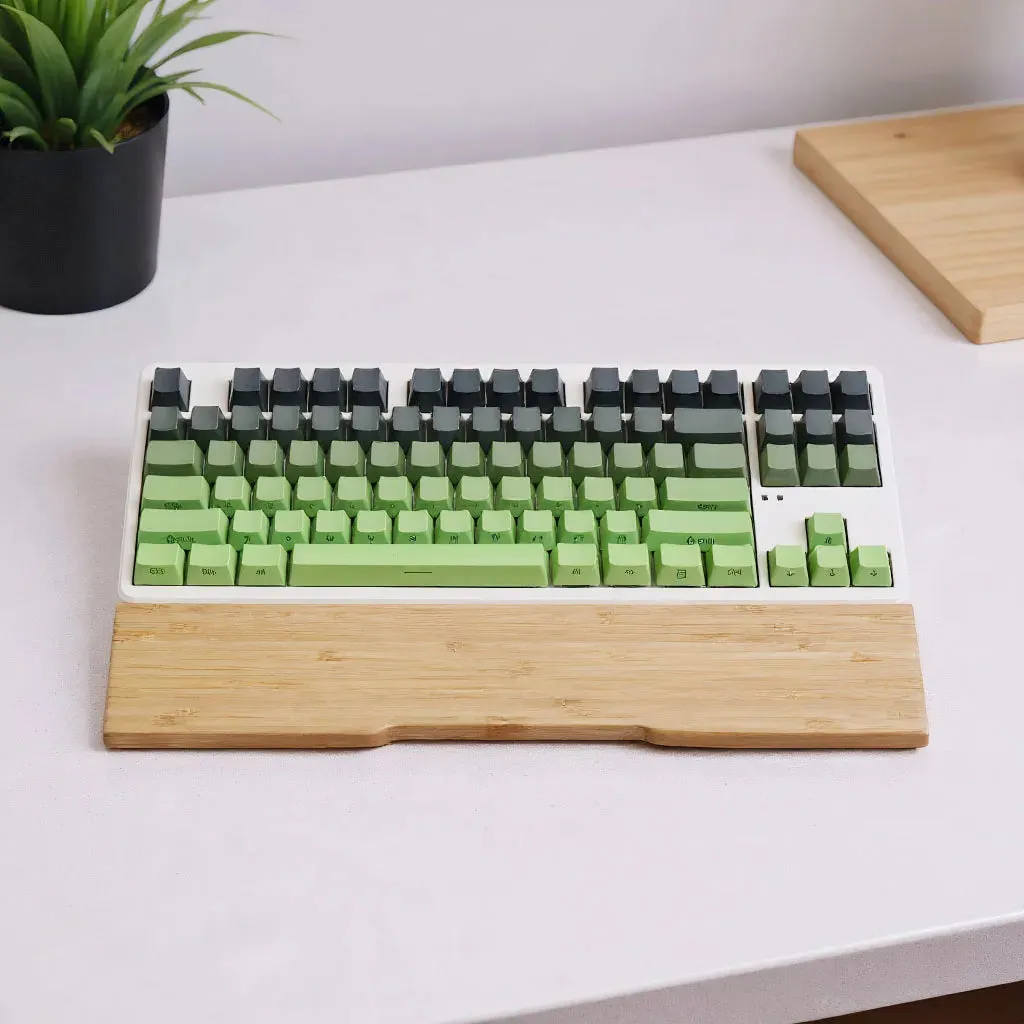 Bamboo keyboard wrist rest with a compact mechanical keyboard